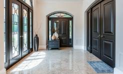 Elegant flake epoxy flooring in a luxury home foyer
